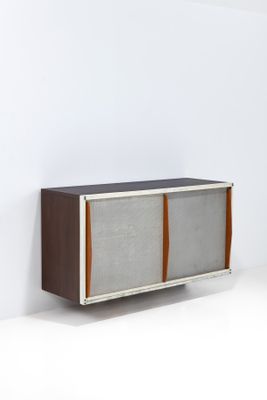 the sideboard is made of wood and has a metal frame