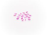 a group of pink petals on a white surface