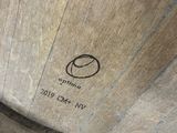 a close up of a wooden barrel on a table