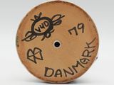 a brown button with a drawing of a bee on it