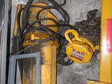 a pile of wires and other equipment in a room