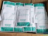 several packets of mystery future in a cardboard box