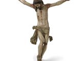 une statue de Jésus sur la croix, sur fond blanc