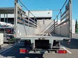 an image of a flatbed truck parked in a parking lot