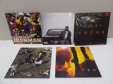 three cds of various albums of various music on a white surface