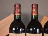 three bottles of wine that are sitting on a table