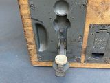 a wooden box with a handle and a latch on it