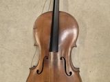 a violin hanging on the wall next to a wall
