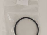 a black rubber o ring in a plastic bag on a white surface