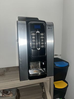 an image of a coffee machine in a small room