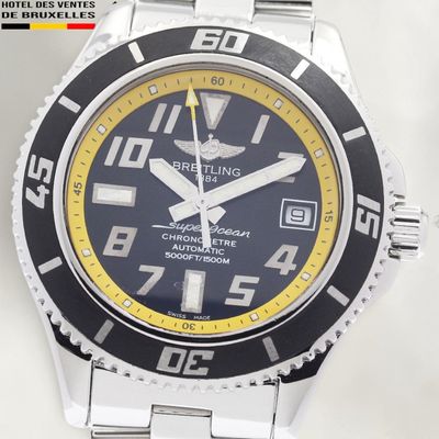 a close up of a wrist watch with a black and yellow face