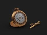 une montre de poche en or et une clé sur fond noir