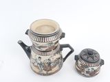 a coffee pot and a tea pot sitting next to each other