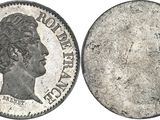 a close up of a coin on a white background