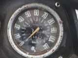 a close up of a speedometer on the dashboard of a motorcycle