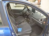 a blue car with the door open and the driver ' s seat down