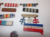 many different types of ribbons and pins on a table