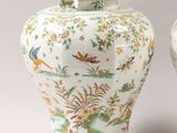 pair of chinese vases with birds and flowers painted on them