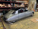 a silver car that is parked in a garage