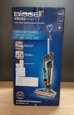 the box of the bissell crosswave vacuum cleaner is on the table