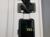 a white box with a cell phone inside of it