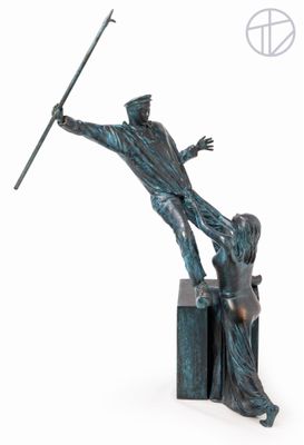 statue of a man holding a spear and a woman standing on a block