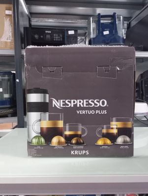 a box of nespresso vertuo plus krups on a shelf