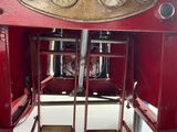 a picture of a red fire truck with gauges and a clock