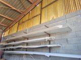many pieces of wood stacked on top of each other in a building