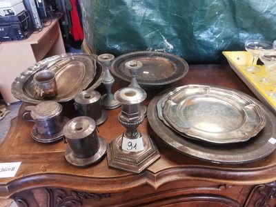 a table with a lot of silver dishes and silverware on it