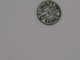 a close up of a white plate with a black and white design on it