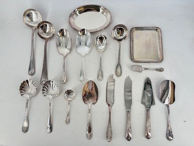 a lot of silver spoons and silverware on the table