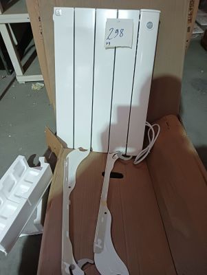 a white electric radiator sitting in a cardboard box