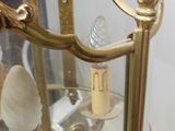 a glass display case with a clock inside of it