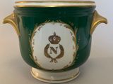 an image of a green and gold vase with a crown on it