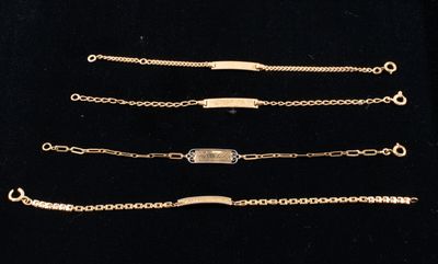 four different types of gold bracelets on a black background