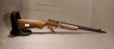an old rifle with a gun on a stand on a white background