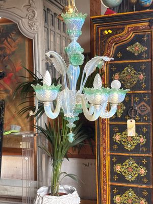 a vase with a plant in it sitting on a table