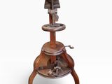 an old wooden and metal stool with a wooden seat on a white background