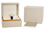 a white box with a watch inside of it