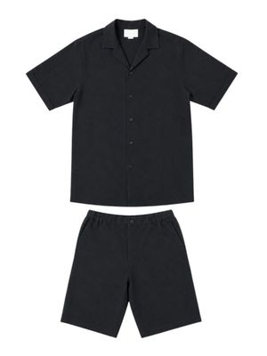 a black shirt and shorts are shown on a white background