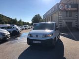 a white van that is parked in front of a building