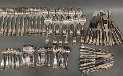 a lot of silver spoons and forks laid out on a table