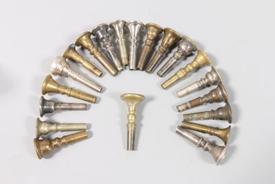 a clock made out of brass and silver objects