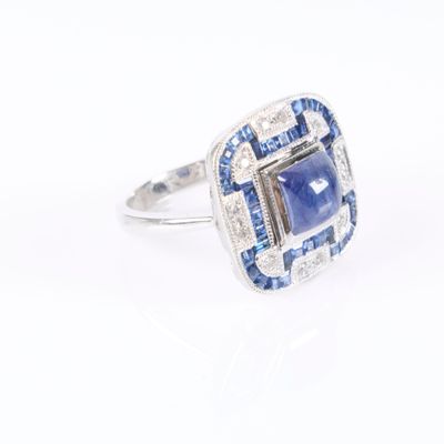 an image of a blue and white diamond ring on a white background