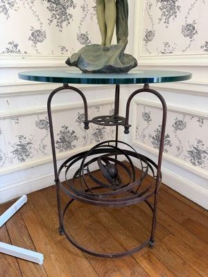 a small table with a statue on top of it