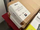 a stack of boxes sitting on top of a red table