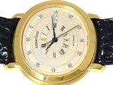 a gold wrist watch with roman numerals on the face