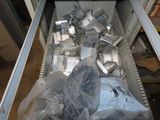 many pieces of metal in a metal container