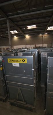 many metal bins in the warehouse with labels on them